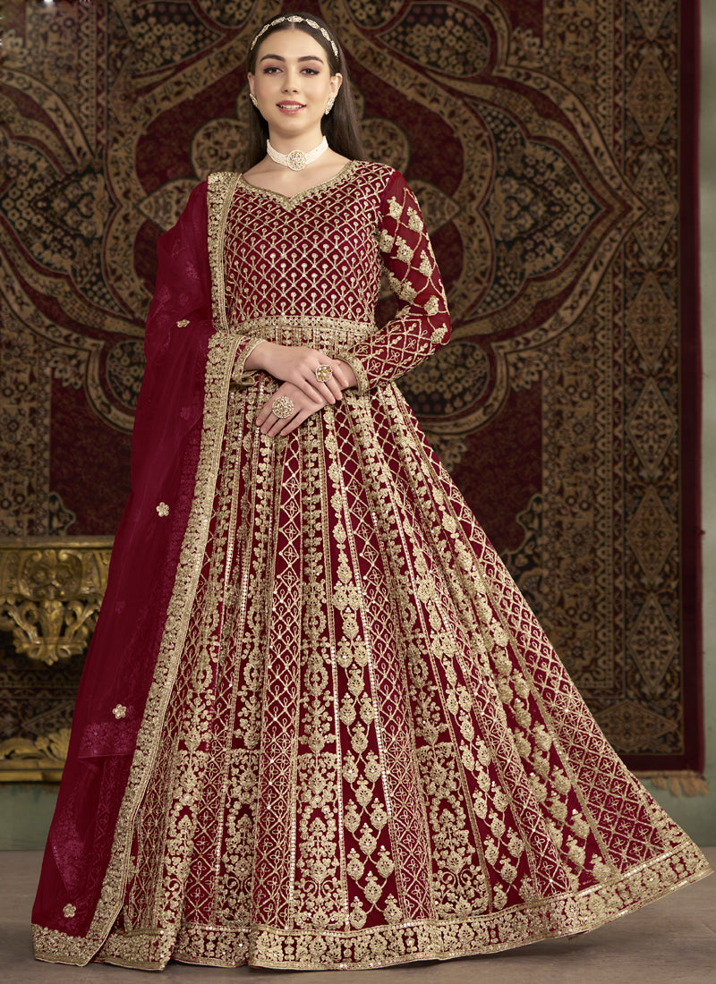 Maroon Net Anarkali suit with heavy embroidery and shimmering finish.