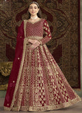 Maroon Net Anarkali suit with heavy embroidery and shimmering finish.