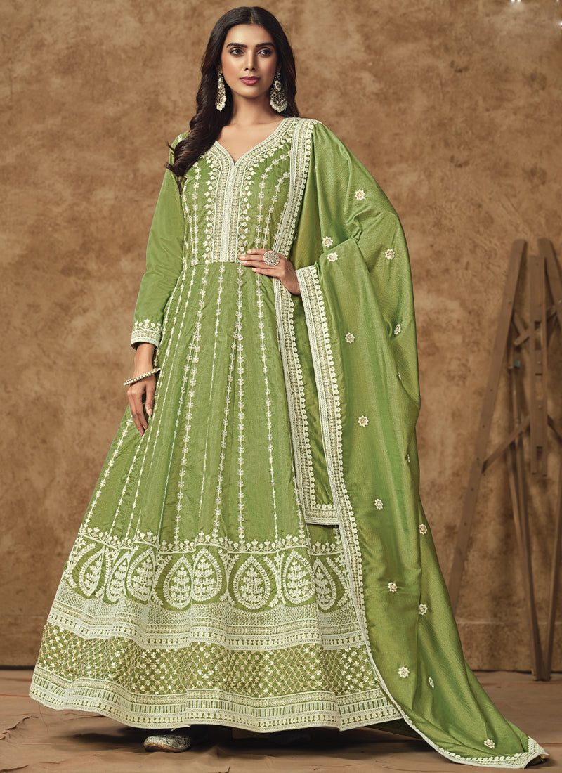 Light Green Dola Silk Anarkali suit with heavy embroidery and gota patti details.