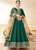 Green Taffeta Silk Anarkali Suit with heavy embroidery and 50-inch length.