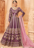 Elegant wine-colored art silk Anarkali suit with heavy embroidery