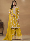Vibrant yellow faux georgette straight kurta with matching sharara and dupatta.