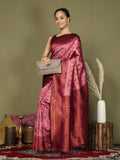 Light Pink Lichi Silk saree with Magenta blouse featuring a elegant drape and silky texture.