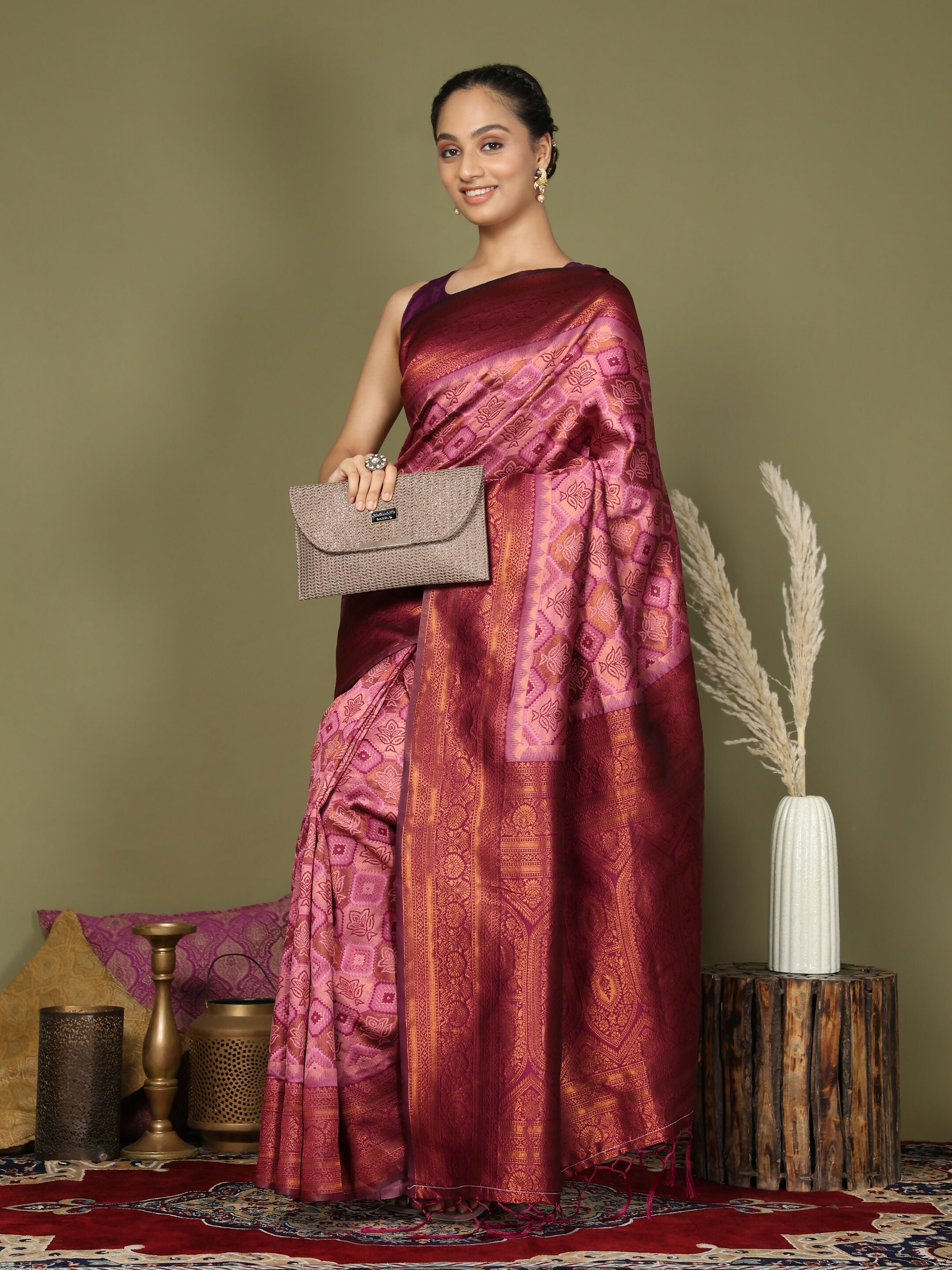 Light Pink Lichi Silk saree with Magenta blouse featuring a elegant drape and silky texture.