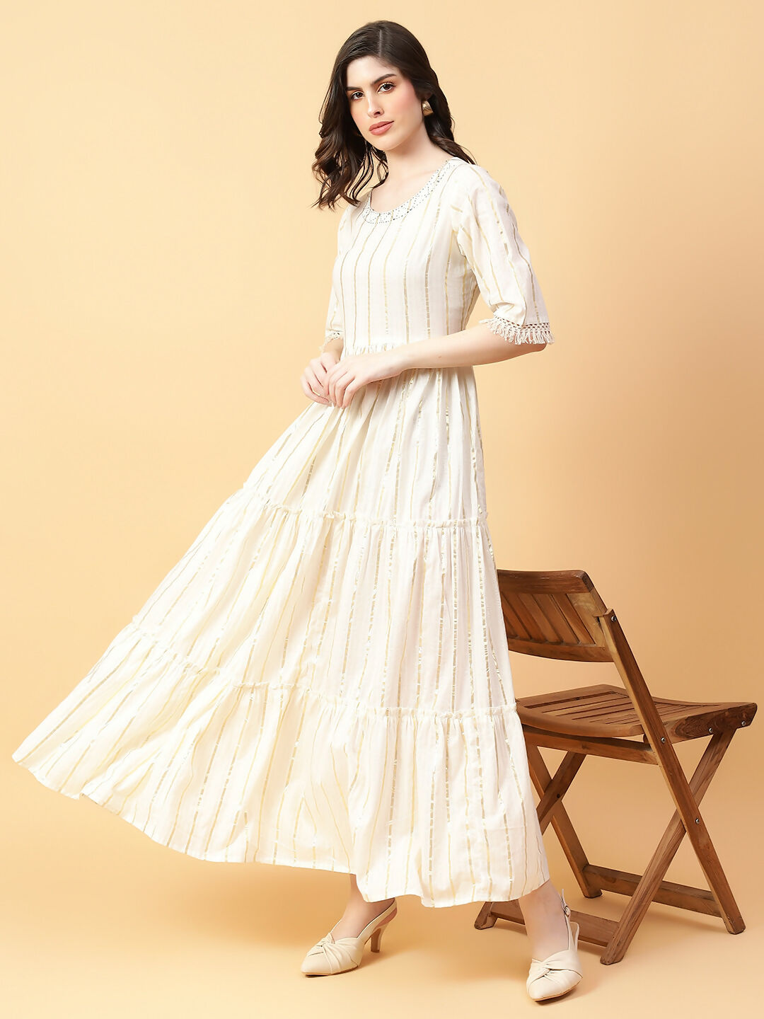 Cream-colored cotton lurex dress with hand work detailing, 53-inch midi length.