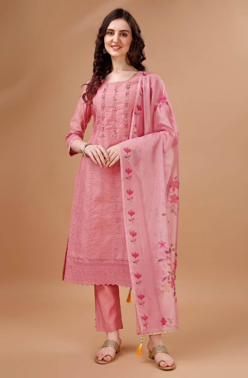 Close-up of a Peach Chanderi silk salwar suit featuring detailed Chikankari embroidery.