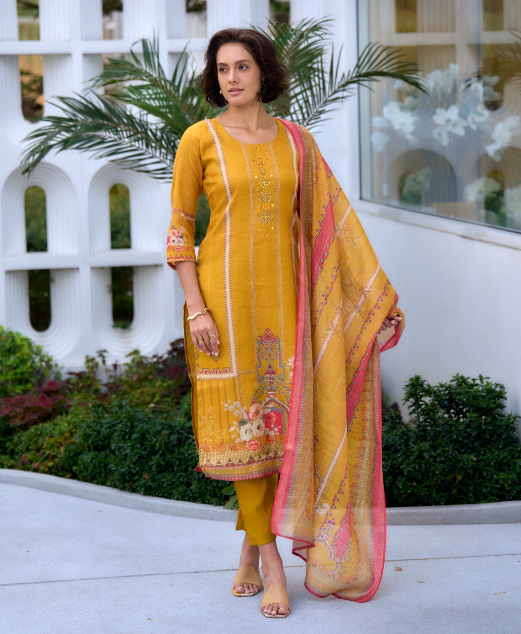 Bright yellow silk blend salwar suit with elegant embroidery details