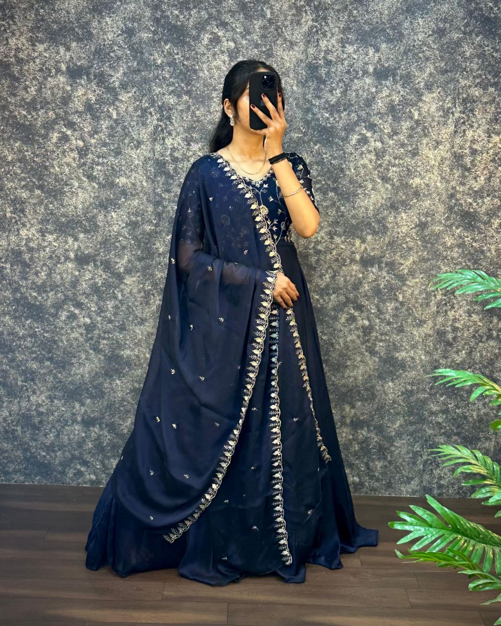 Deep blue silk gown featuring intricate embroidery and coordinated dupatta