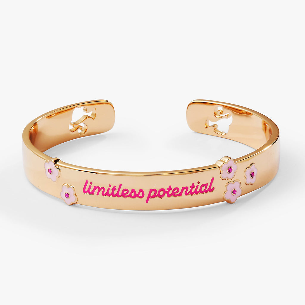 Gold and pink Barbie™ logo cuff bracelet on a neutral background