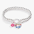 Barbie™ stretch charm bracelet featuring iconic charms on a flexible band.