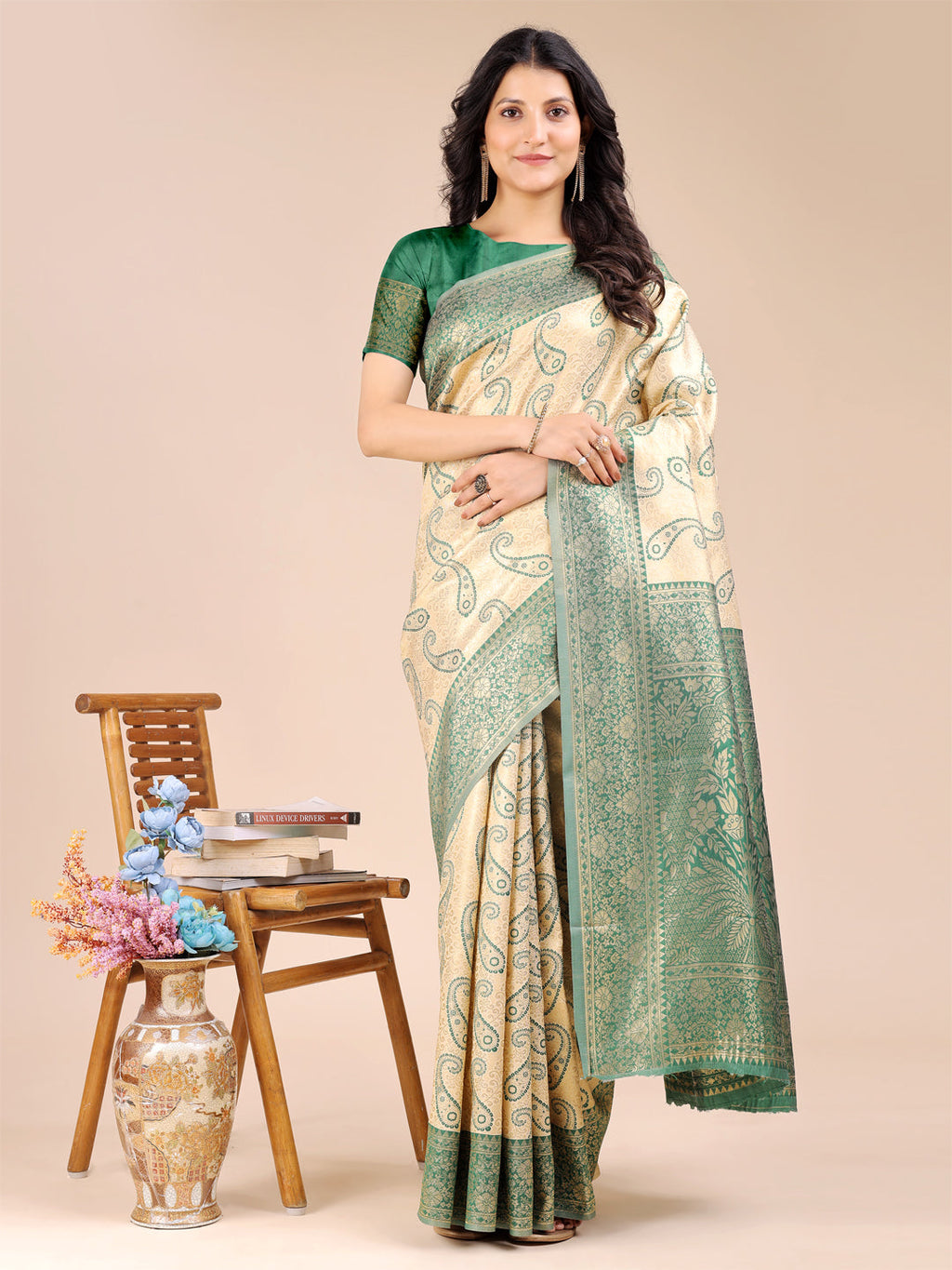 Cream and green Banarasi silk saree with intricate woven zari border and traditional tassels