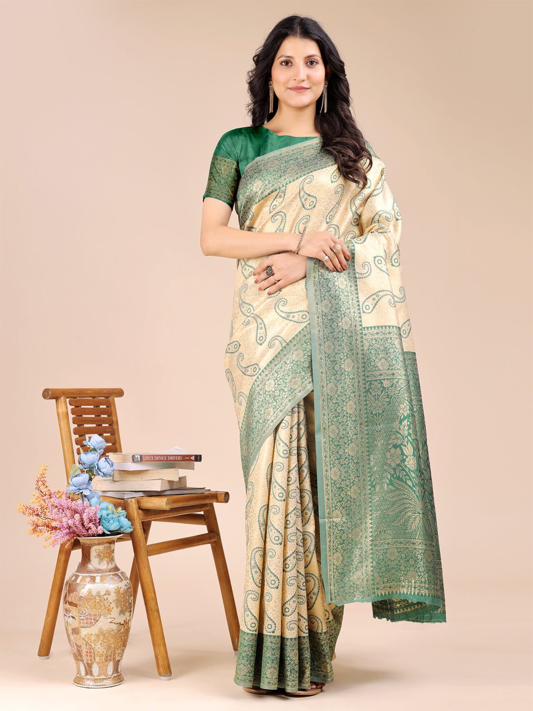 Cream and green Banarasi silk saree with intricate woven zari border and traditional tassels