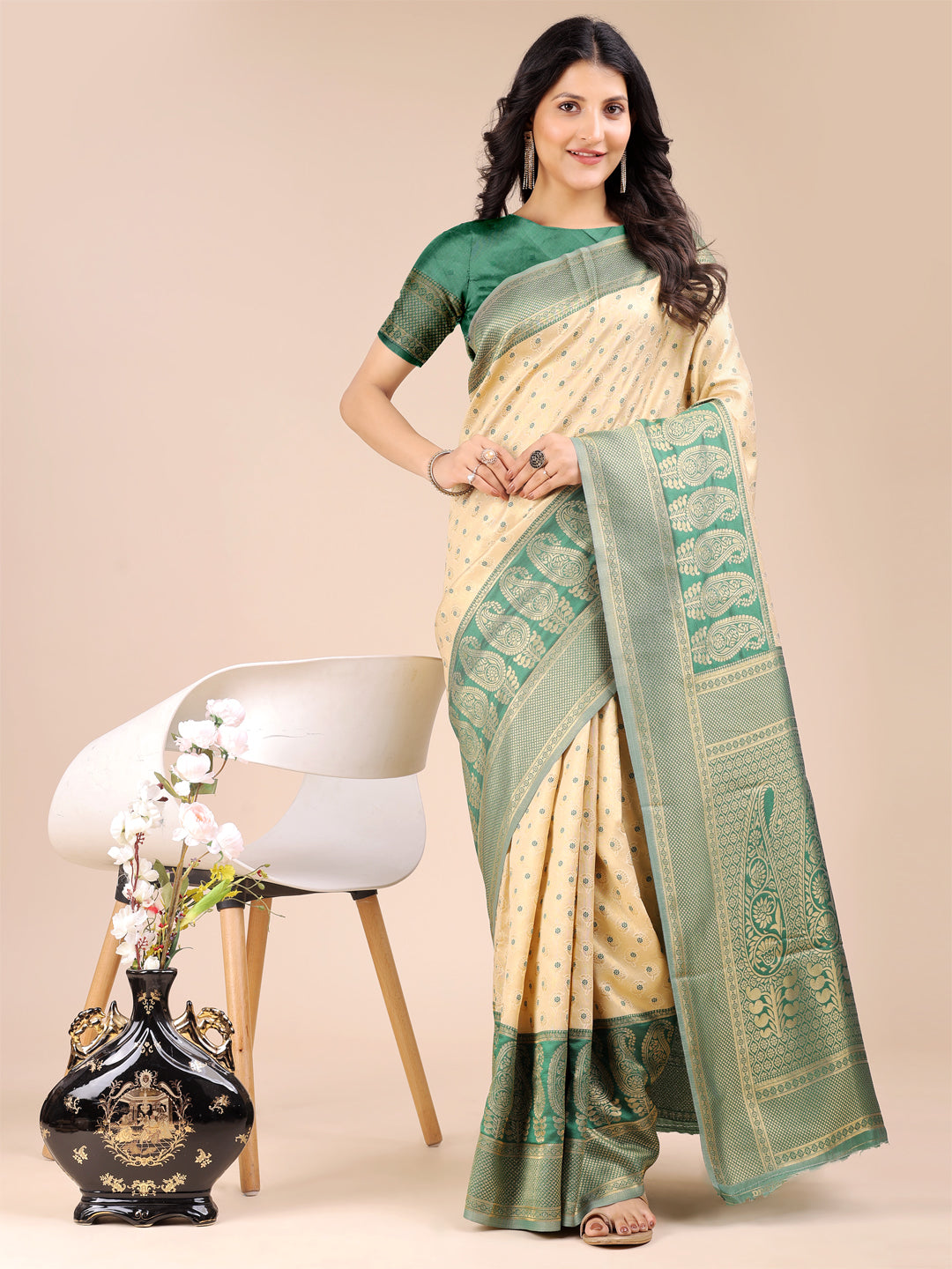 Cream and green Banarasi silk saree with gold zari woven work and traditional tassel detailing