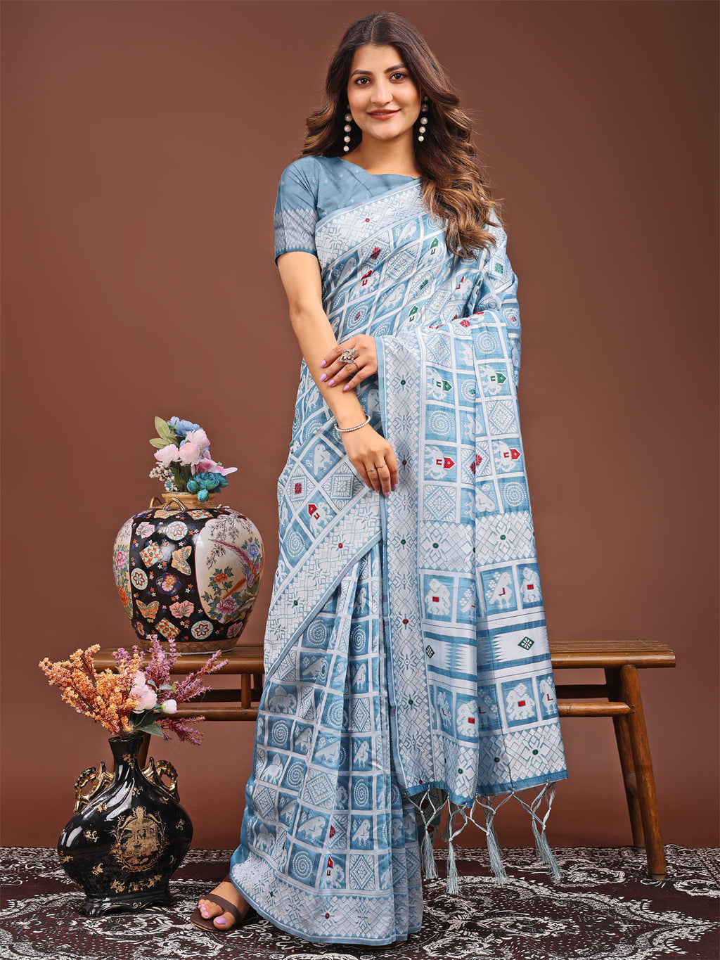 Sky blue linen cotton saree featuring intricate geometric and tribal woven motifs