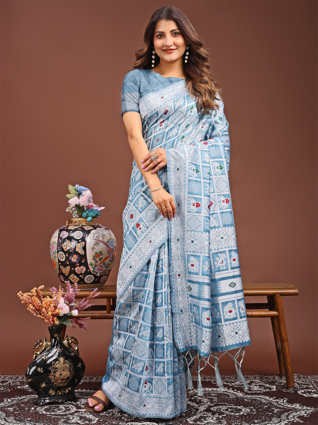 Sky blue linen cotton saree featuring intricate geometric and tribal woven motifs