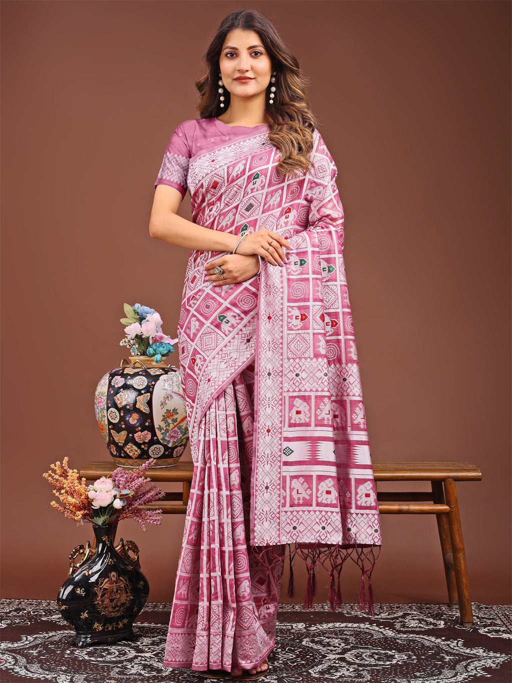 Pink linen cotton saree featuring traditional geometric and tribal motifs