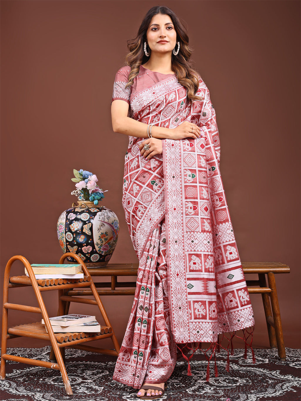 Peach linen cotton saree with woven tribal and geometric patterns.