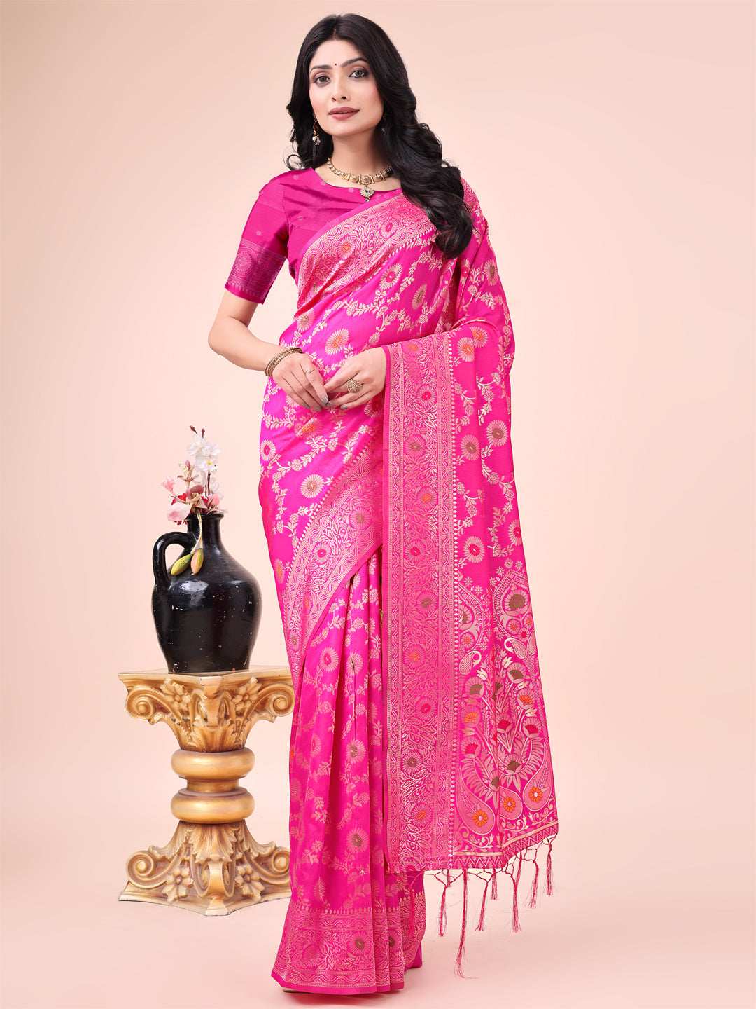 Elegant pink Banarasi cotton saree with gold zari leaf motifs and a rich woven pallu.