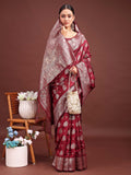 Deep maroon Banarasi silk saree featuring traditional gold zari work