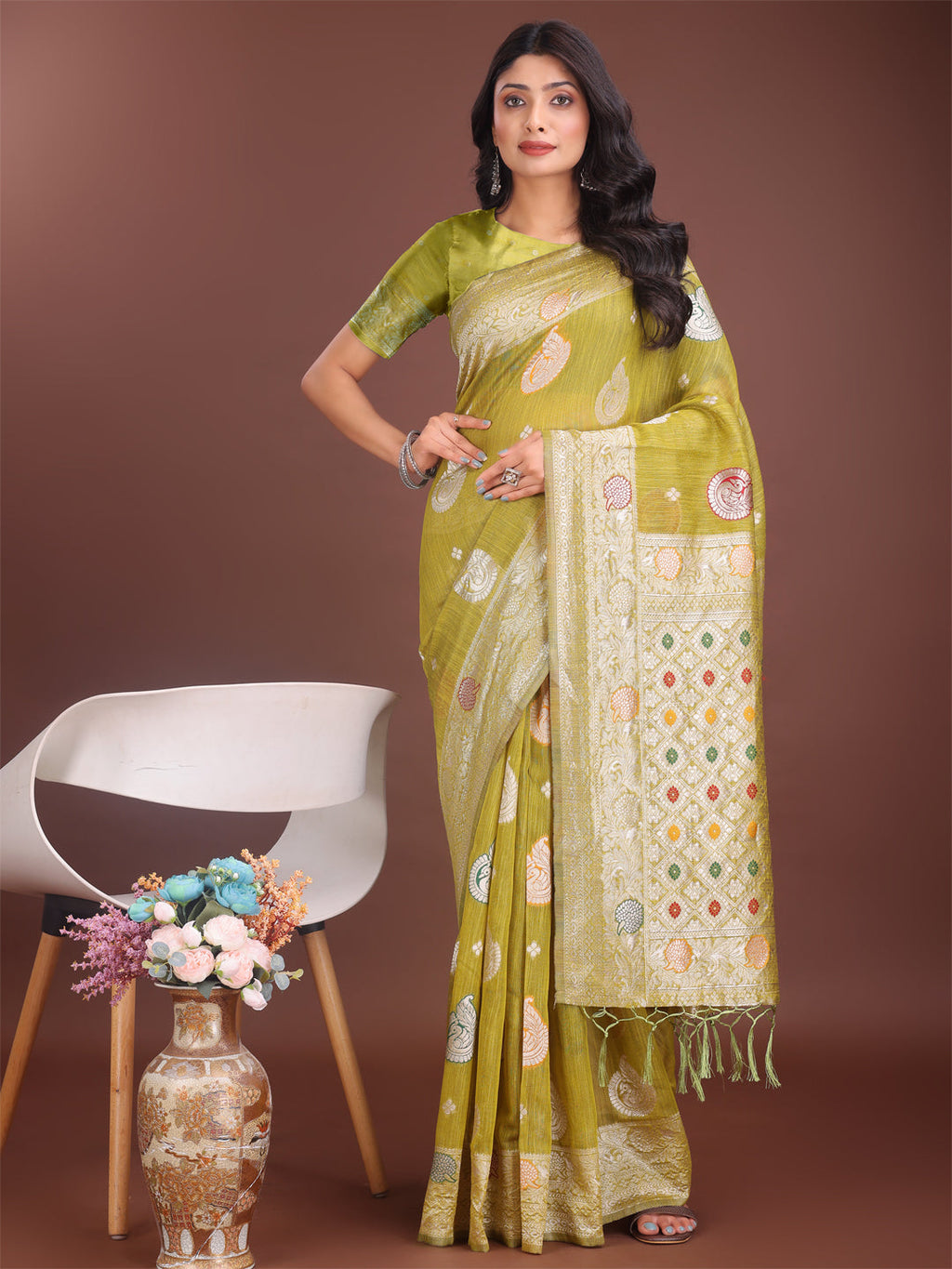 Olive green linen cotton saree with a refined zari border and delicate woven motifs