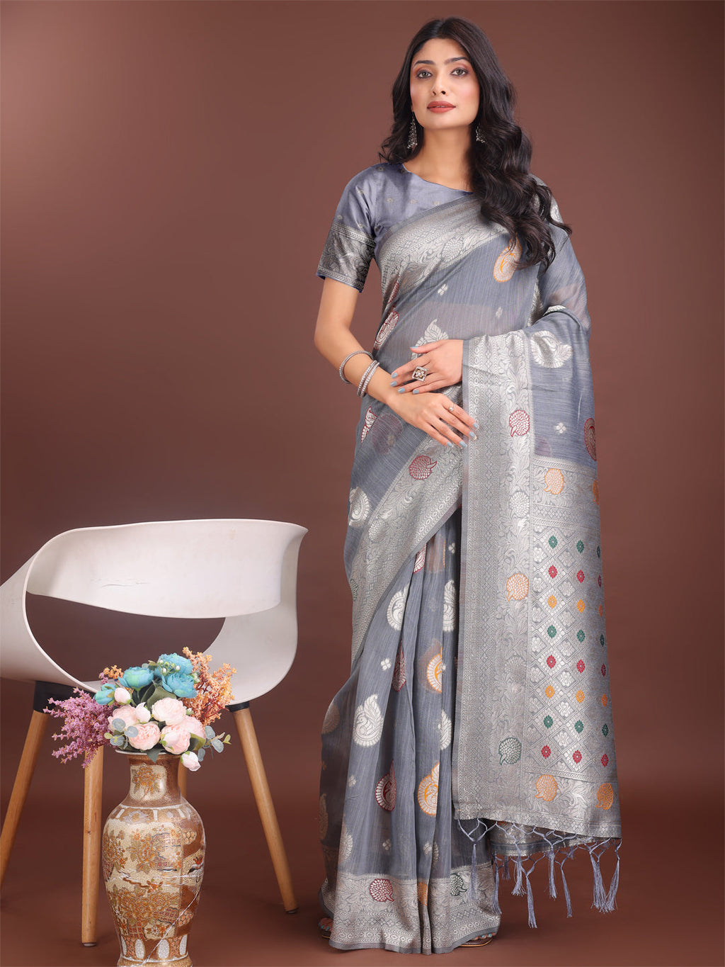 Elegant Grey linen cotton saree with zari border and woven motifs