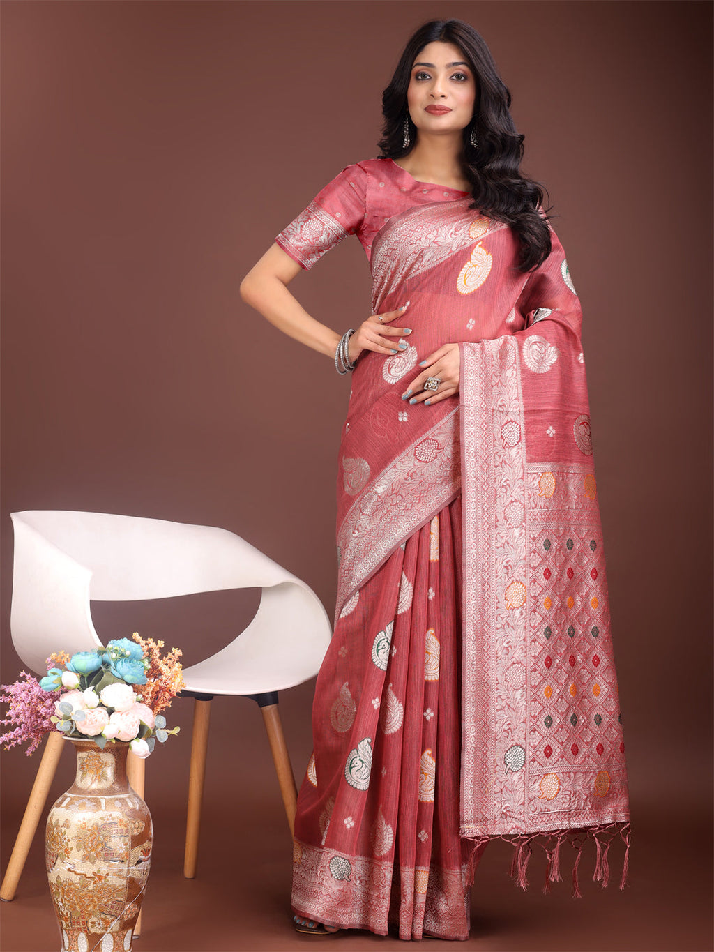 Elegant Pink linen cotton saree with detailed gold zari border and woven motifs.