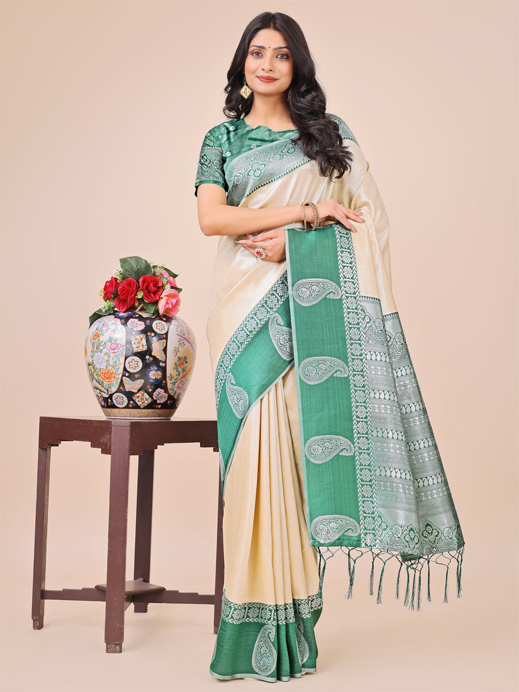 Dual-tone cream silk saree with an intricately woven border and paisley pallu