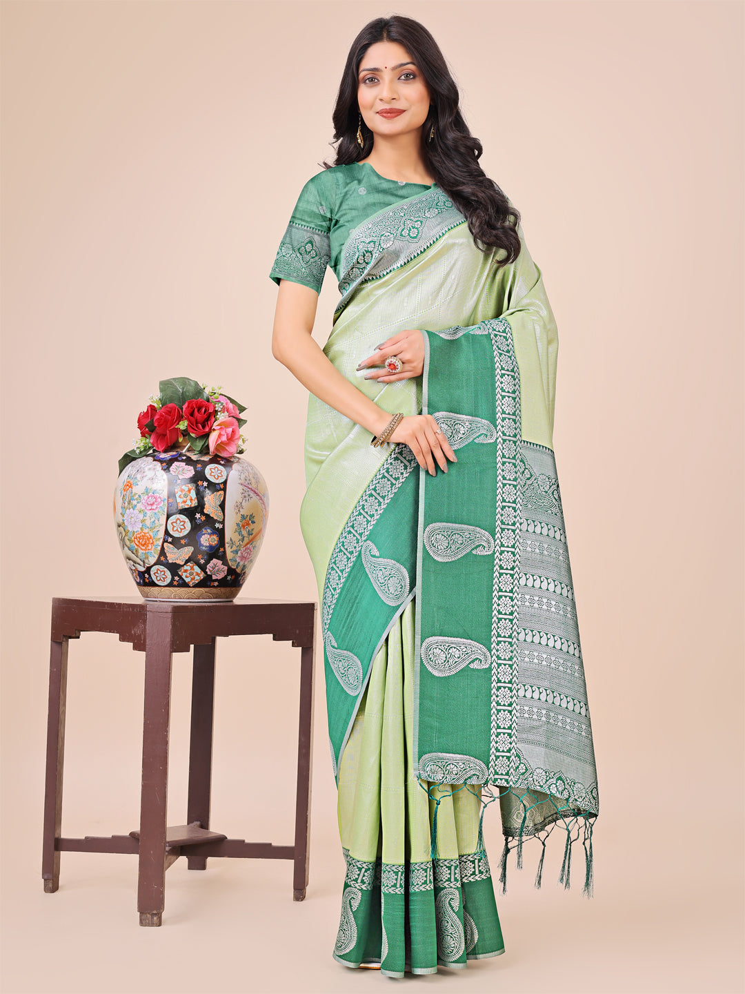 Dual-tone green silk saree with intricate paisley motifs and rich woven border