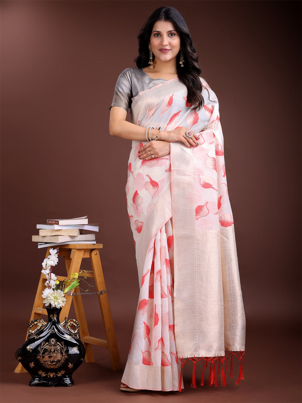 White and Red cotton saree with traditional woven Zari details and pallu tassels