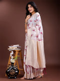 White and purple cotton saree with woven zari details and traditional tassels