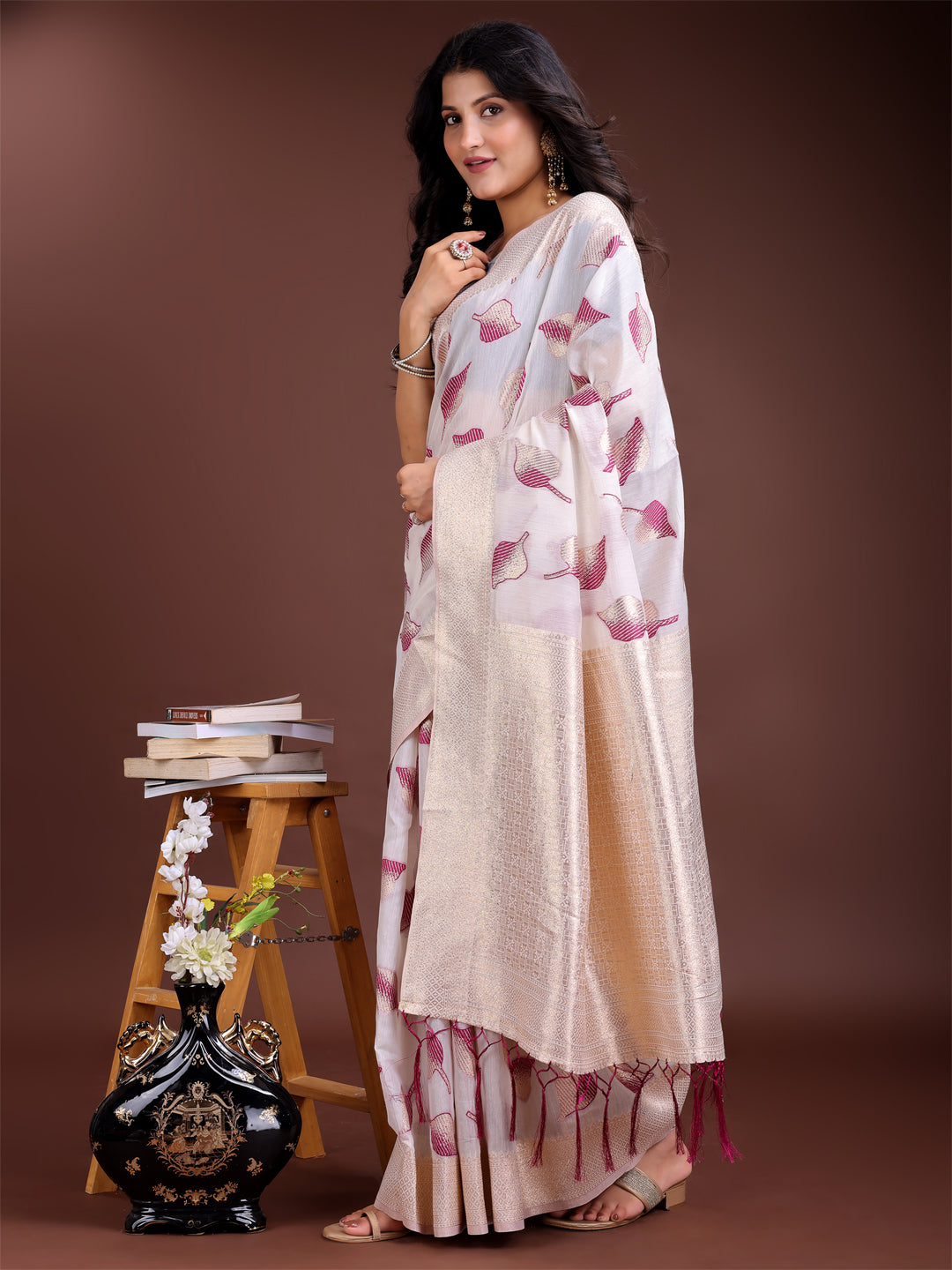 White and purple cotton saree with woven zari details and traditional tassels