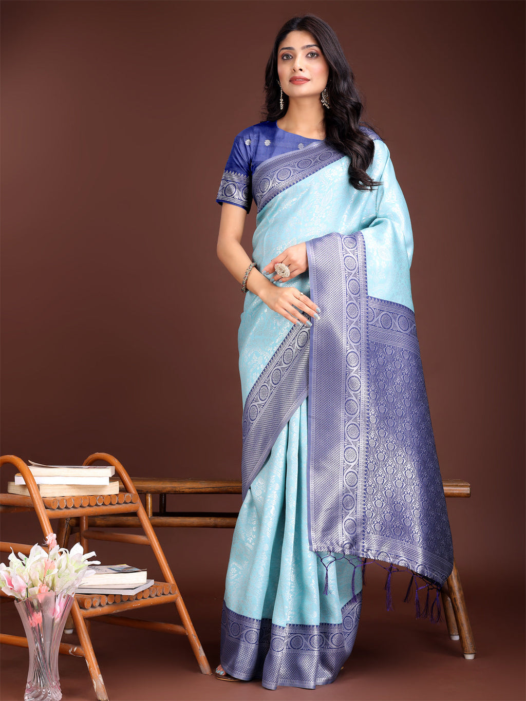 Teal and blue Banarasi silk saree featuring an intricate rich gold zari border.