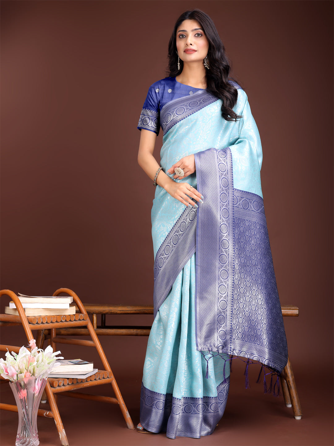 Teal and blue Banarasi silk saree featuring an intricate rich gold zari border.