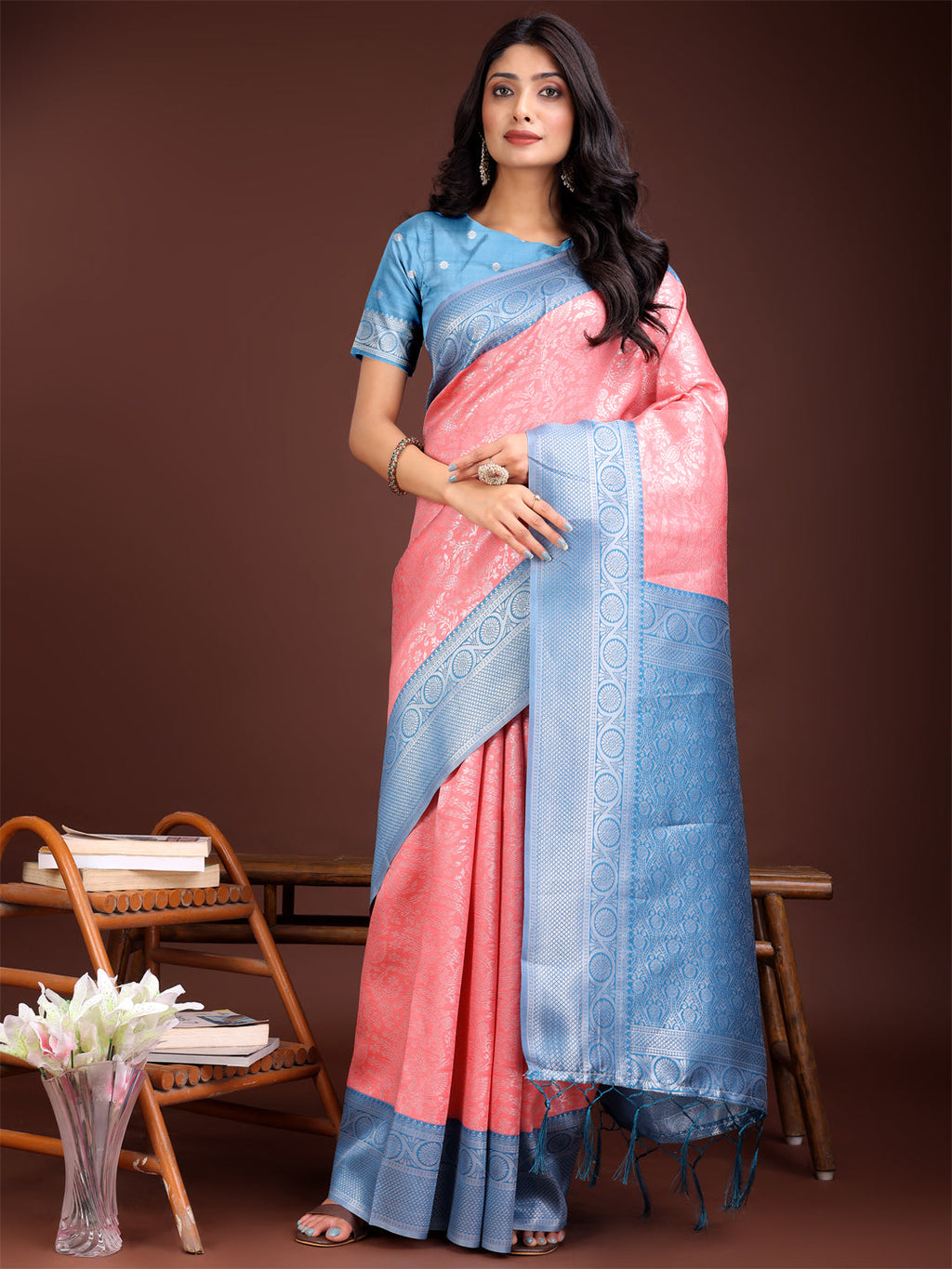 Peach and Blue Banarasi silk saree featuring a detailed gold zari woven border