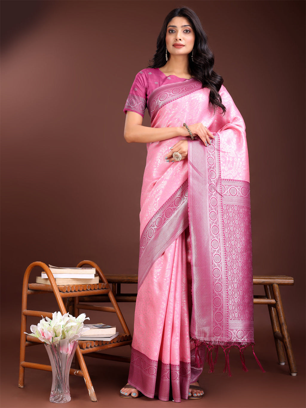 Light pink and pink dual-tone Banarasi silk saree with ornate gold zari border.