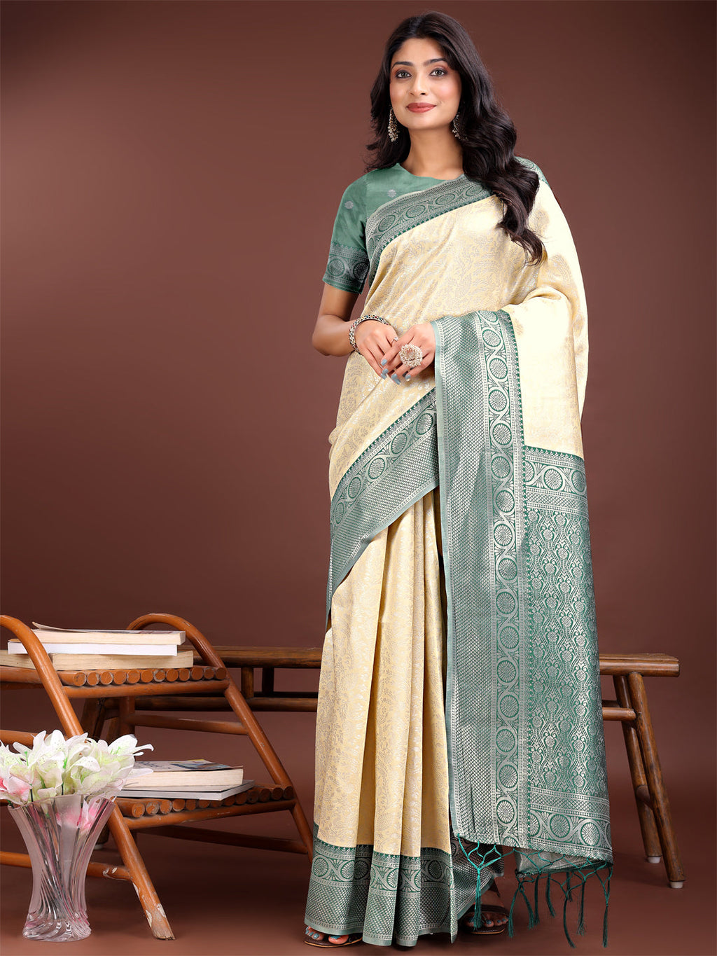 Cream and green Banarasi silk saree with detailed rich zari border work.