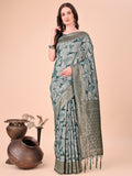 Green cotton silk saree with intricate floral patterns and rich pallu