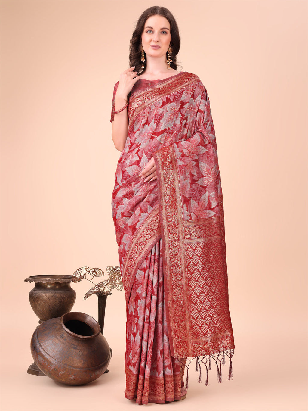 Elegant red cotton silk saree with floral design and rich woven pallu