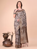 Brown cotton silk saree featuring intricate floral patterns and a richly woven pallu