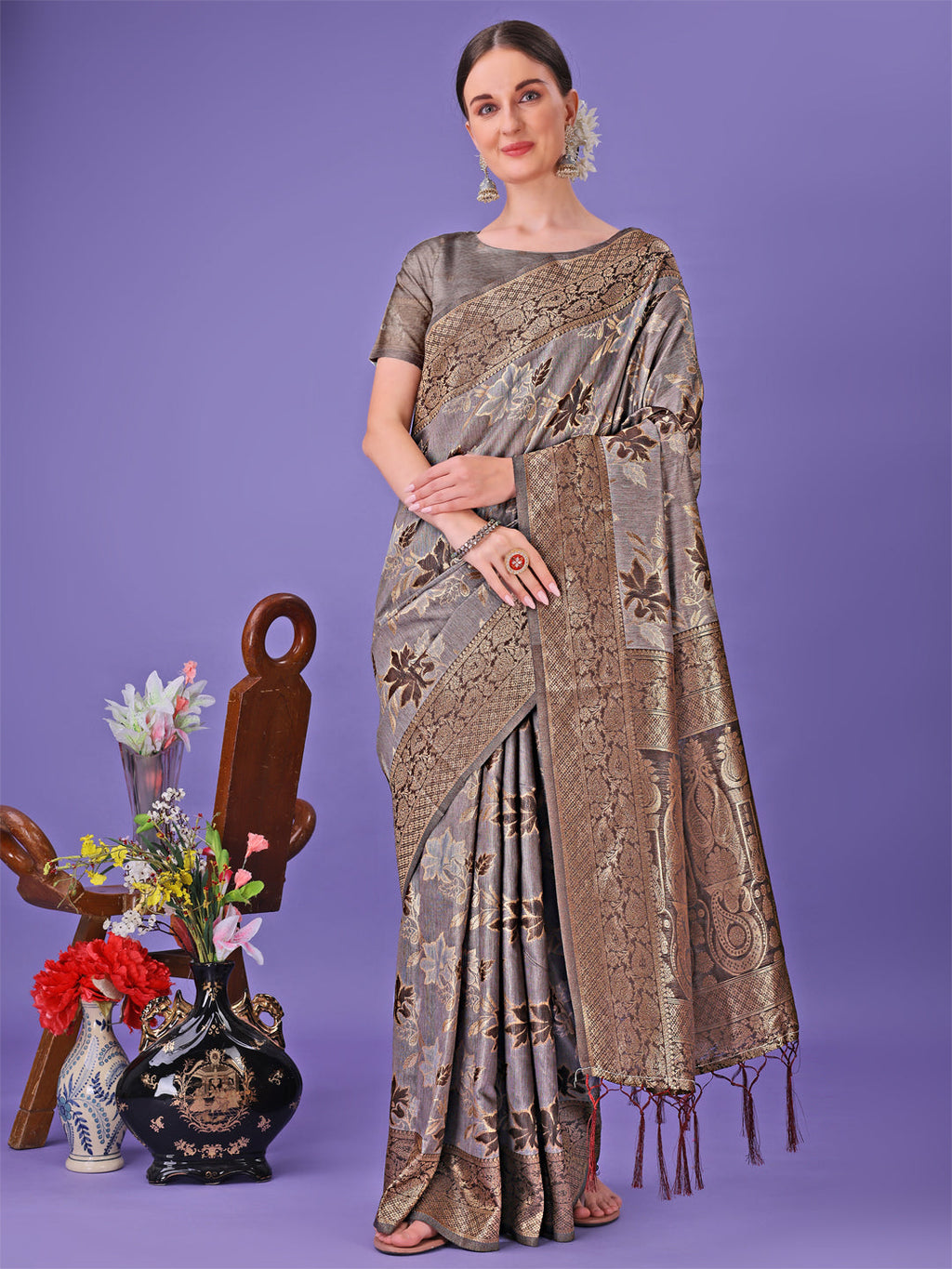 Sophisticated grey lichi silk saree with floral zari patterns and rich pallu
