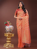 An elegant orange linen saree featuring silver zari butta detailing and a woven pallu.