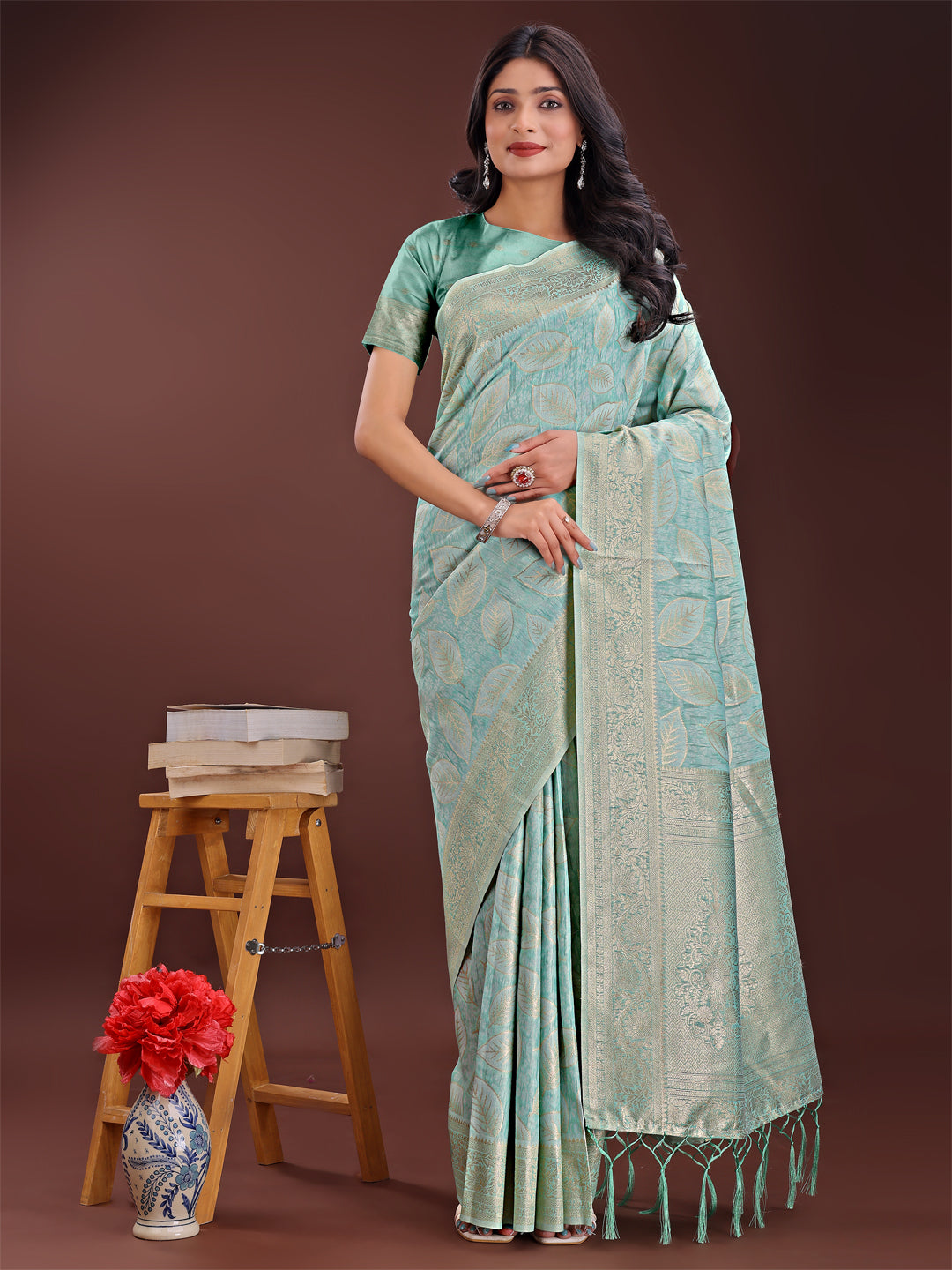 Sea green linen cotton saree with golden zari leaf design and elegant pallu