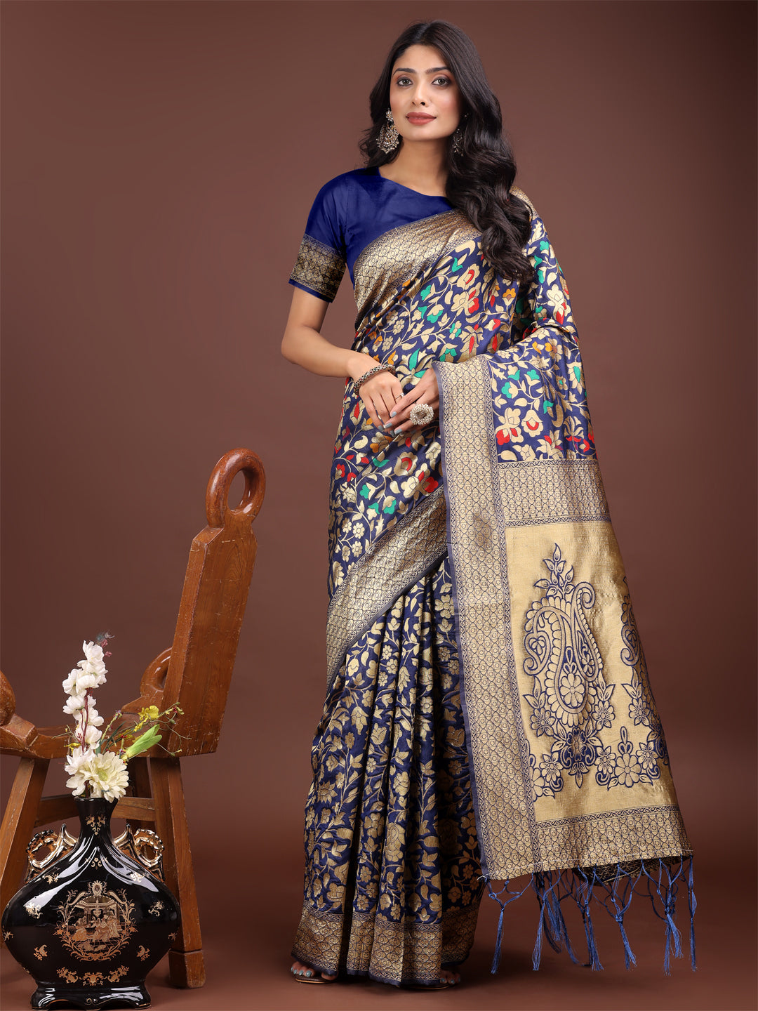 Navy blue silk saree with intricate gold zari and floral pattern