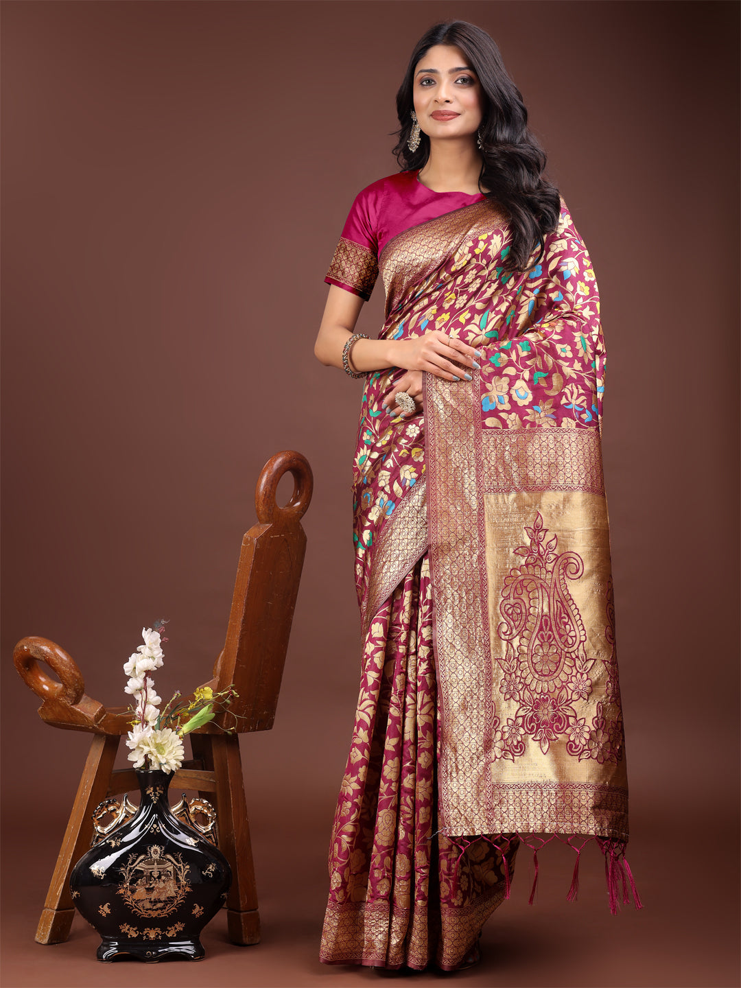 Magenta silk saree with gold zari borders and floral embroidery