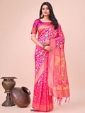 Pink silk saree featuring intricate gold zari floral embroidery and a festive drape