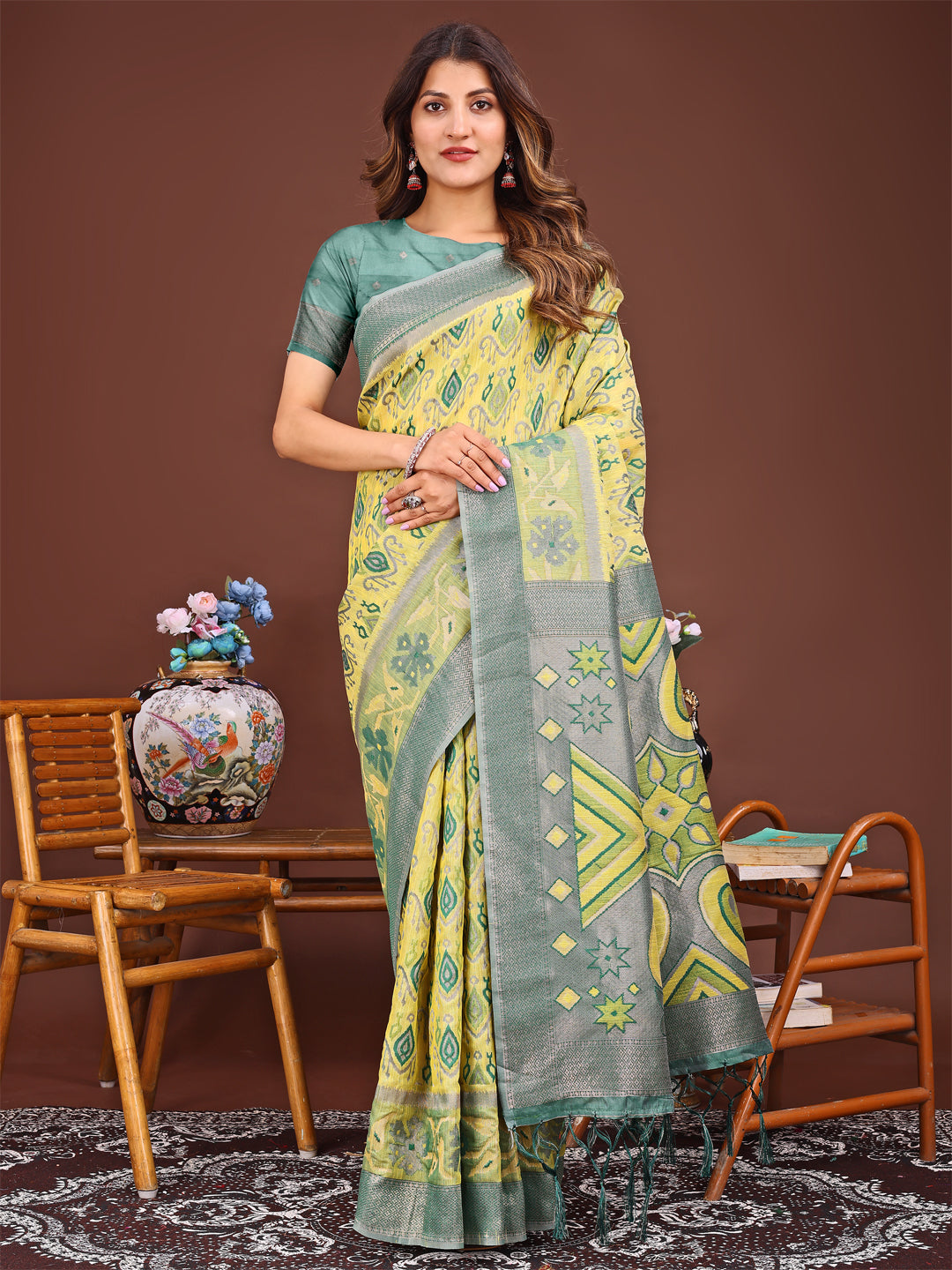 Yellow linen cotton saree with traditional Patola geometric patterns and tassel details
