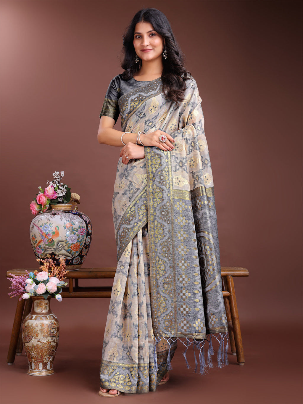 Beige and grey linen cotton saree with intricate woven patterns and grey pallu