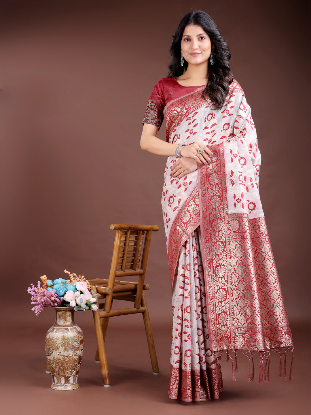 Maroon linen cotton saree with zari weaving and traditional tassel finish