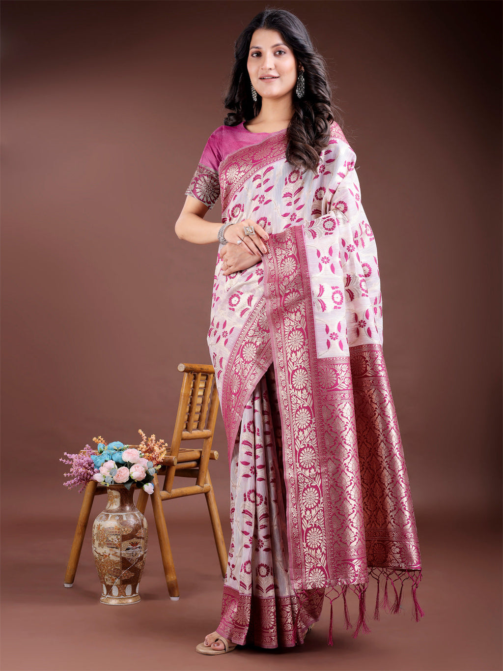 Deep purple linen cotton saree accented with ornate gold Zari work and matching tassels.