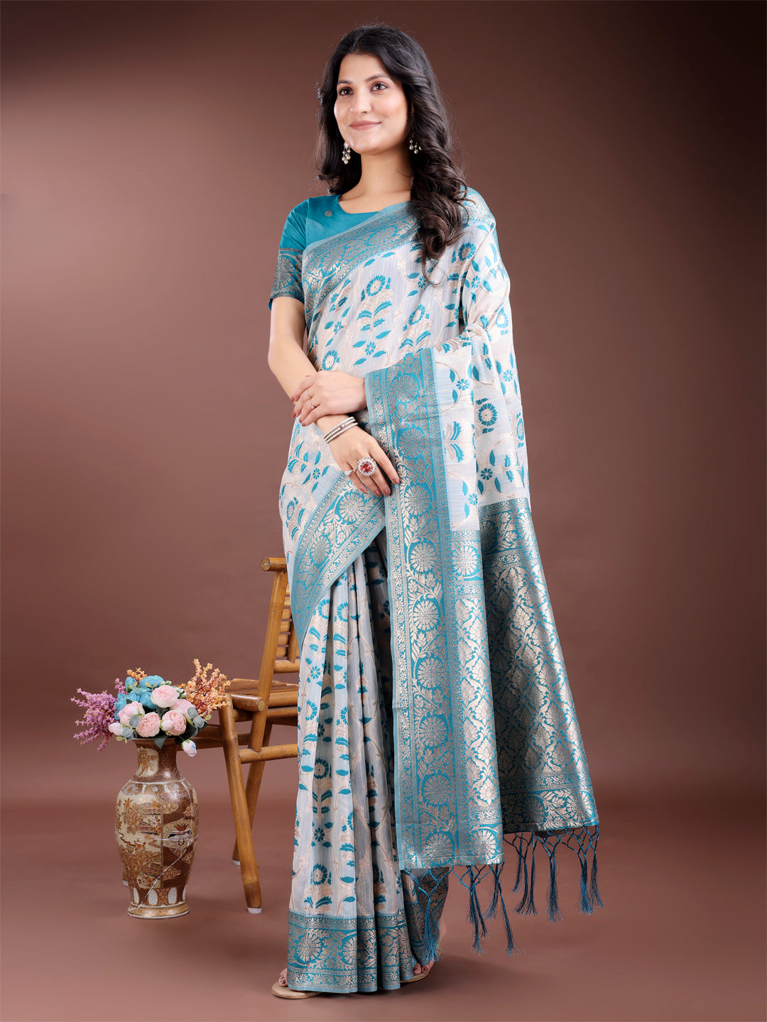 Sea green linen cotton saree with gold zari work and traditional pallu tassels
